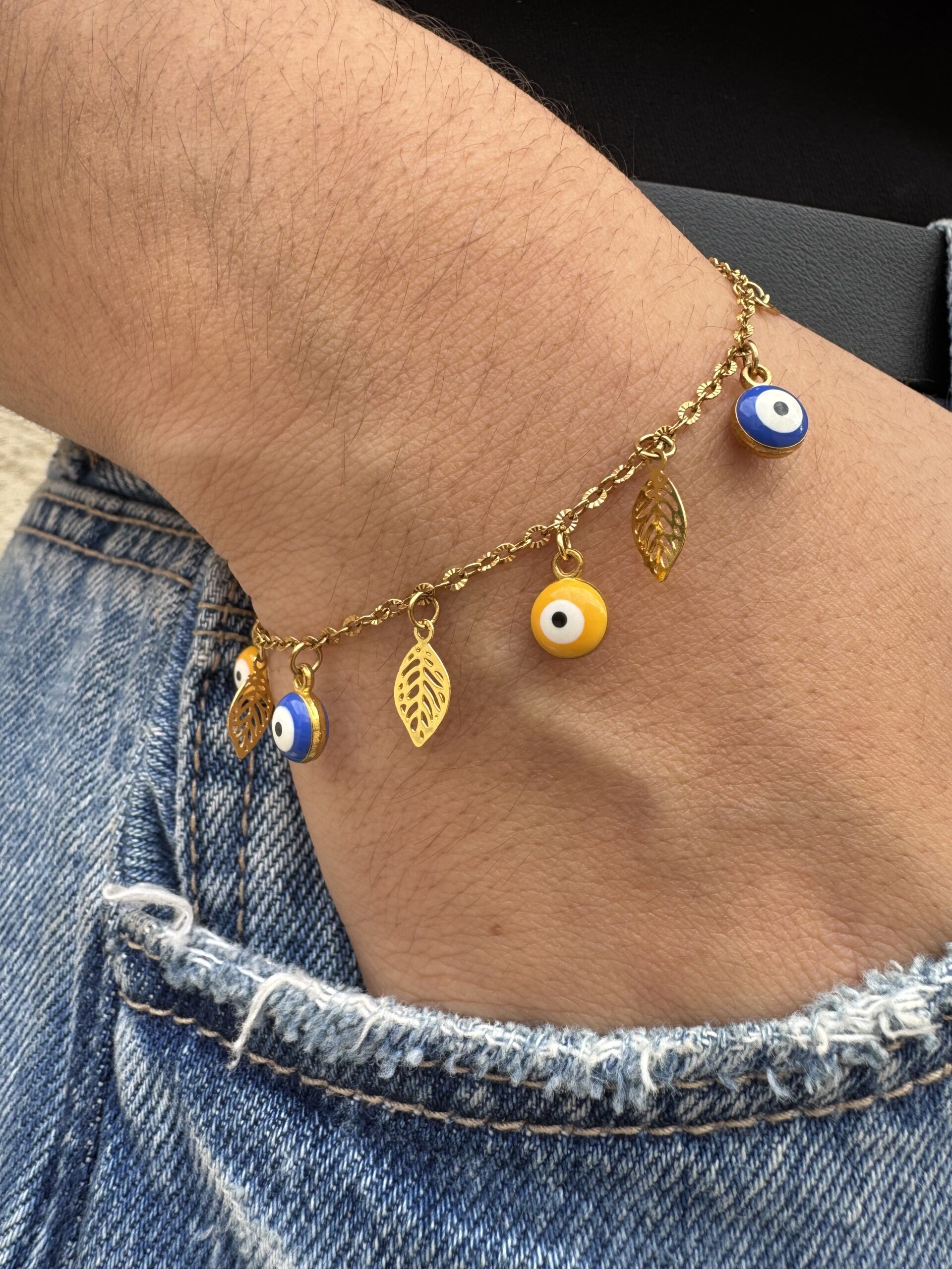 Bracelet œil et plumes