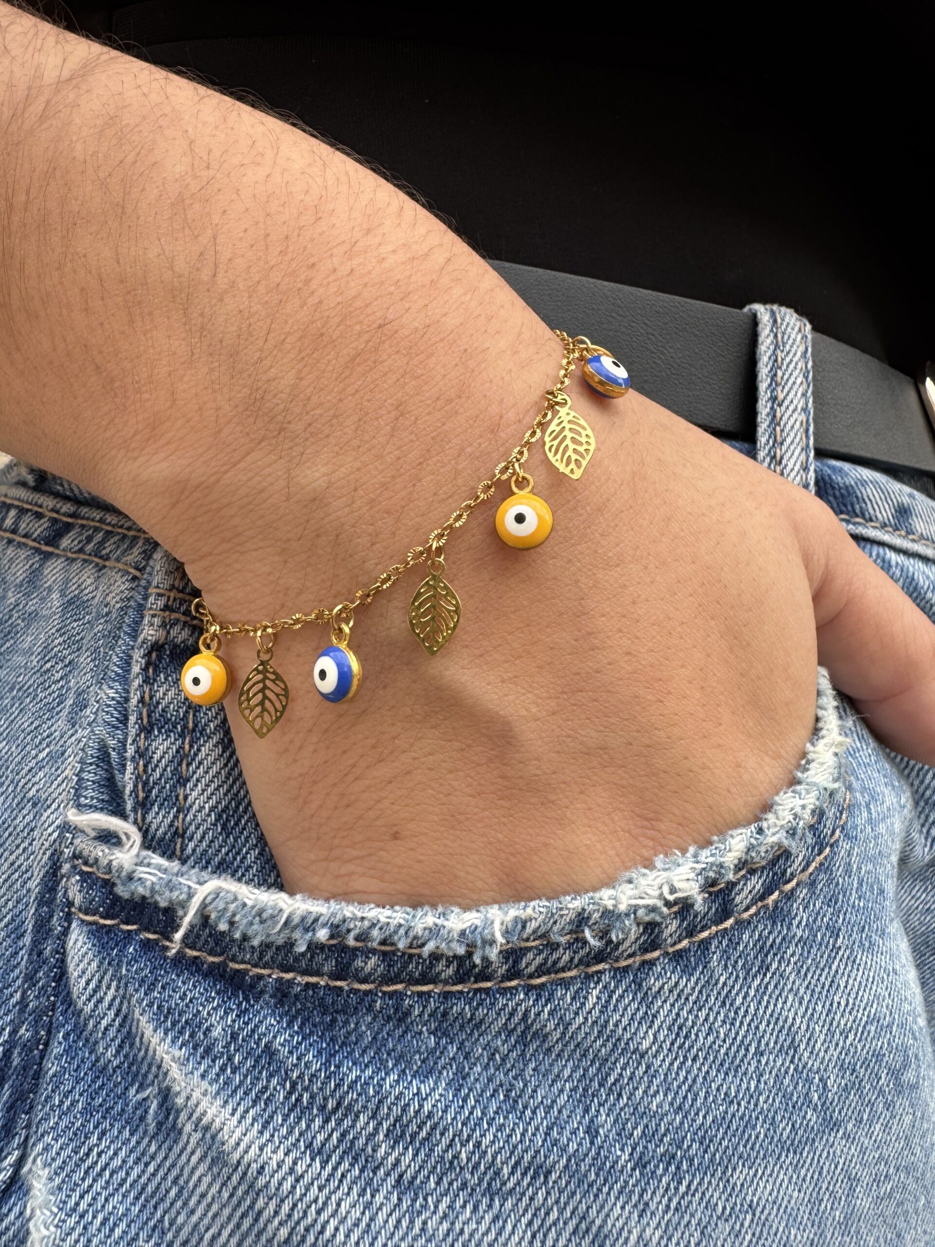 Bracelet œil et plumes