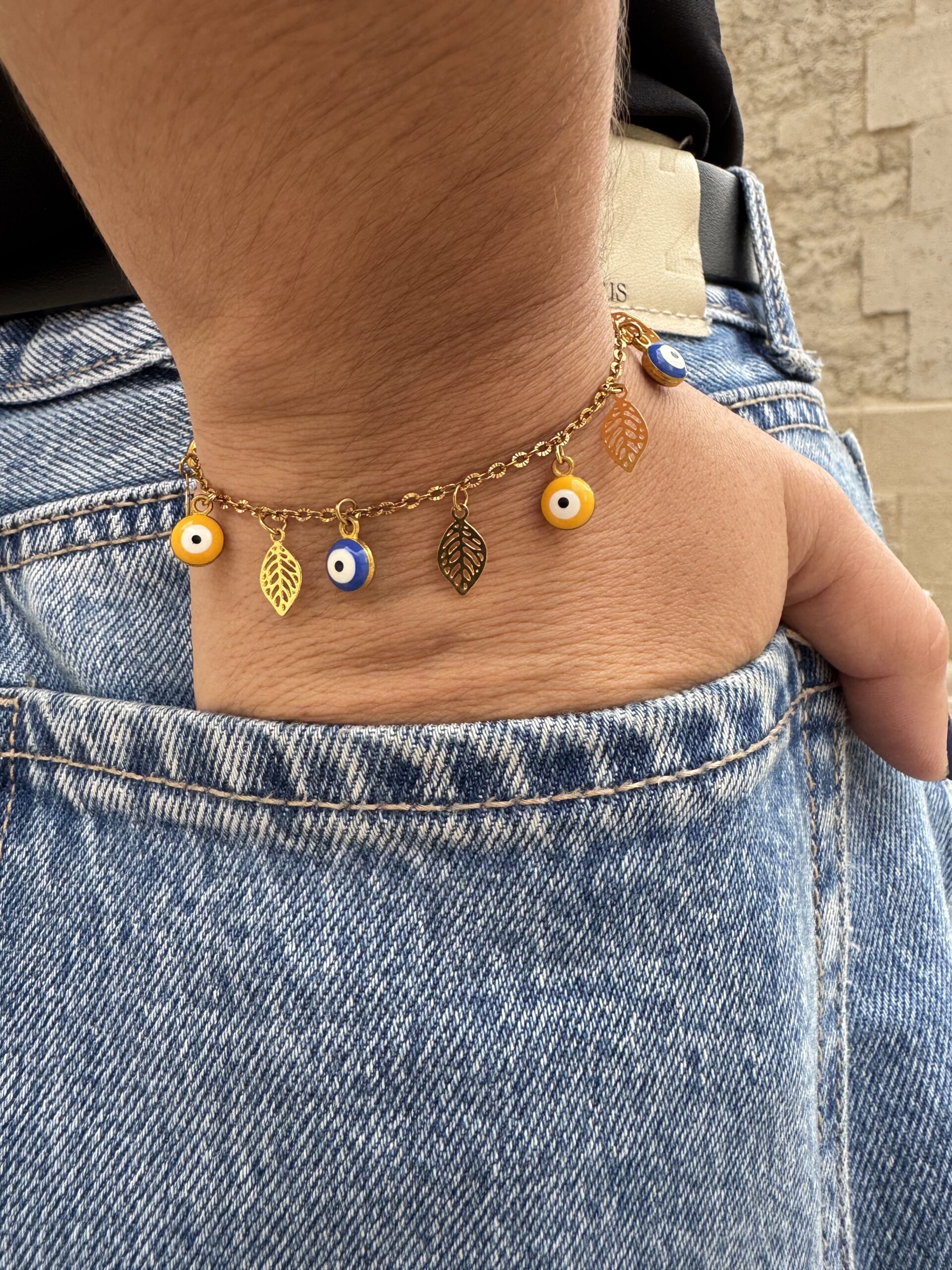 Bracelet œil et plumes